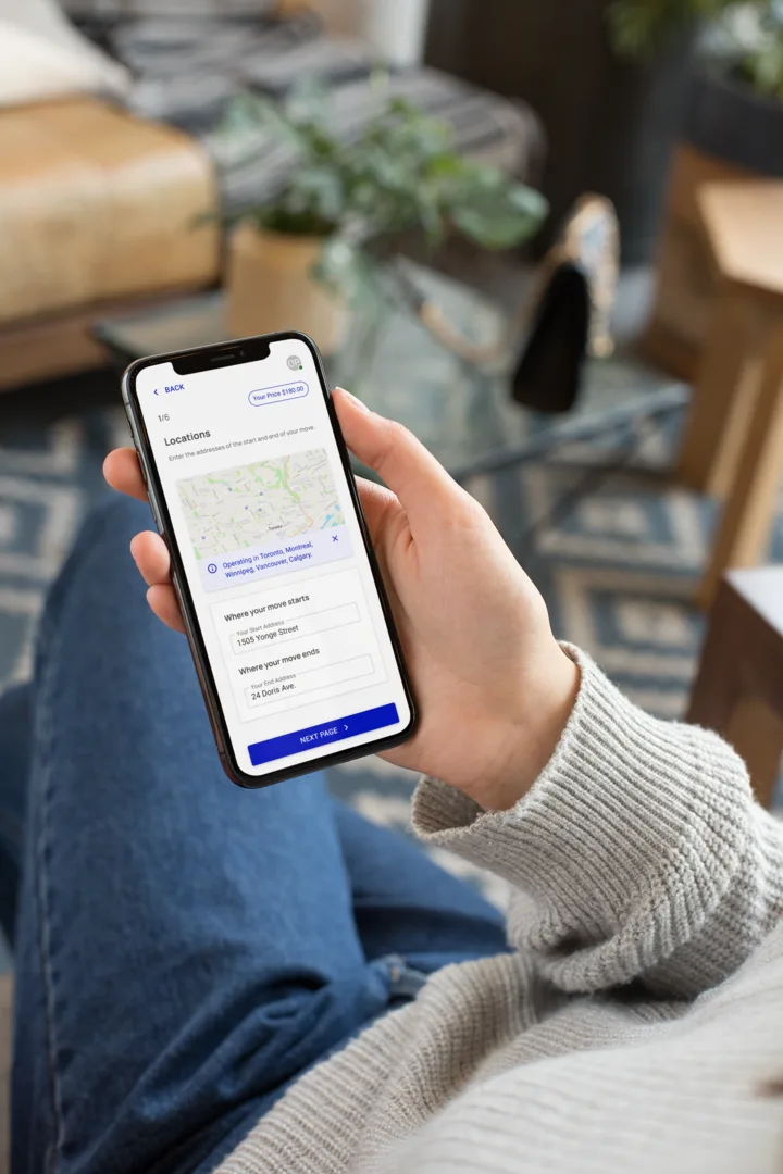 MoveMate booking app shown on a phone for planning a move